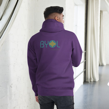 A young man wearing a purple "BYOL: a mindset" hoodie, viewed from the back. The hoodie features the "BYOL" logo in teal and yellow on the back and is available in multiple colors (black, red, maroon, brown, plus more) and sizes (S-3XL). The "be you out loud" logo is displayed at the top.