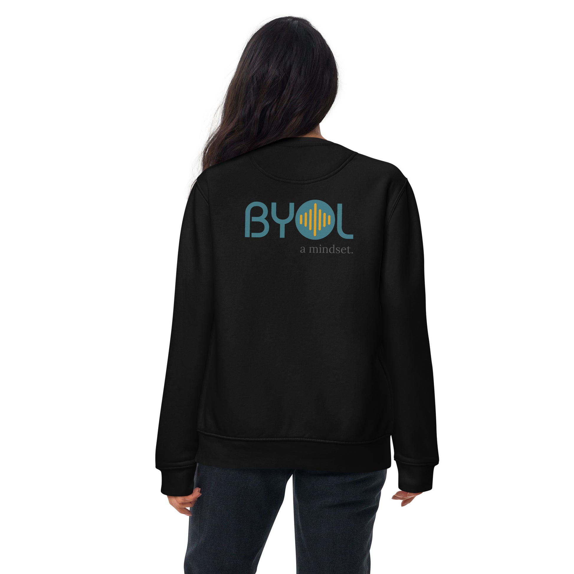 Back view of a woman wearing a black BYOL mindset sweatshirt with color options in black, dark gray, pink, and light gray, available in sizes S to 2XL.