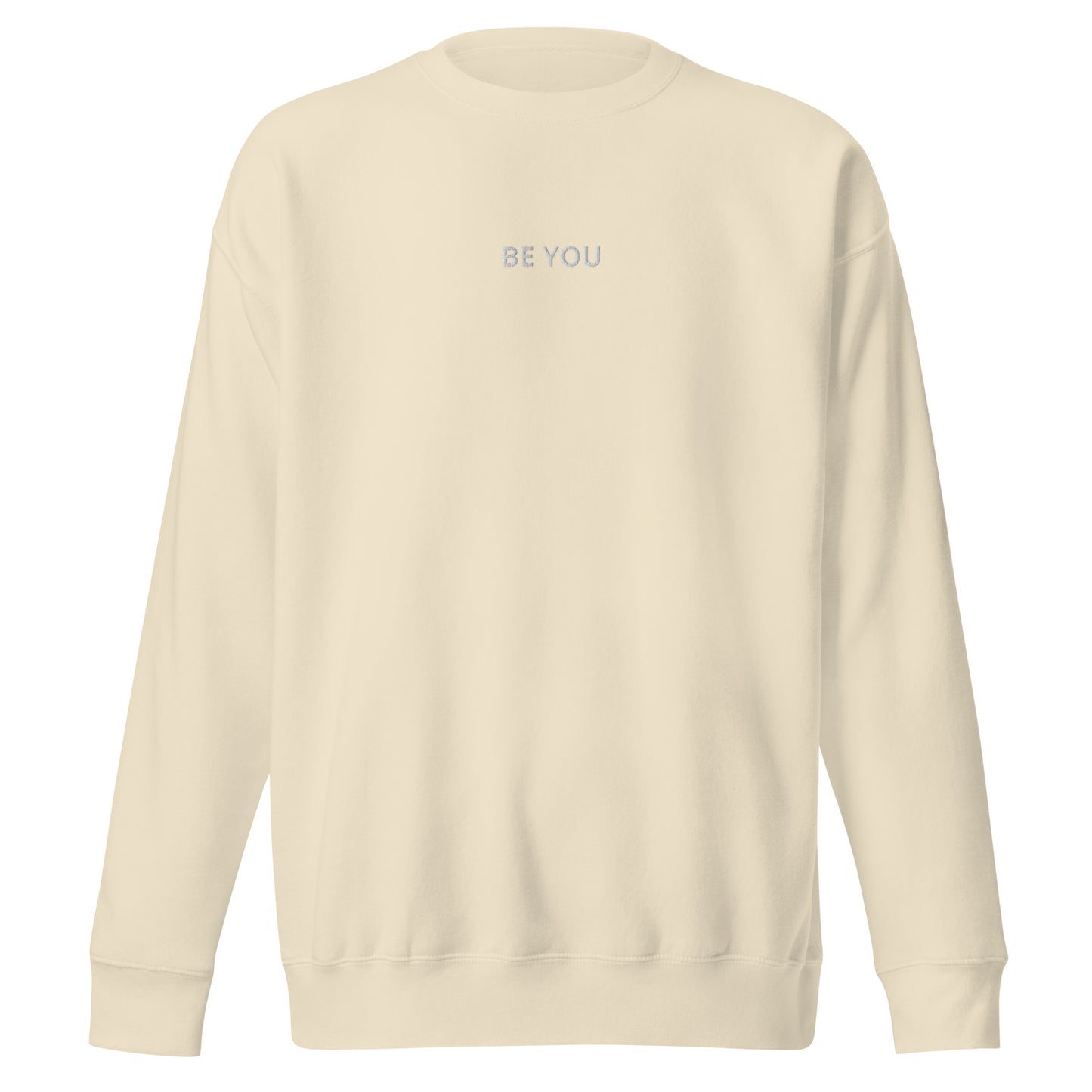 sand embroidered "Be You" premium crew neck sweatshirt with soft fleece interior, ribbed cuffs, and hem.