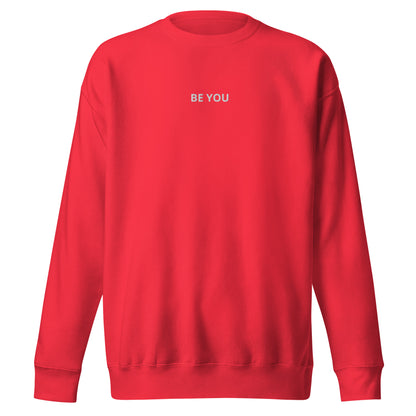 Red embroidered "Be You" premium crew neck sweatshirt with soft fleece interior, ribbed cuffs, and hem.