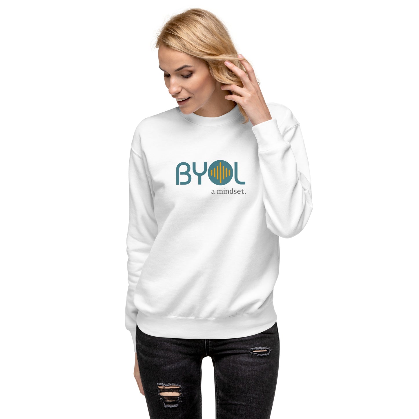 Woman wearing a white BYOL mindset sweatshirt with color options in black, dark gray, pink, and light gray, available in sizes S to 2XL.