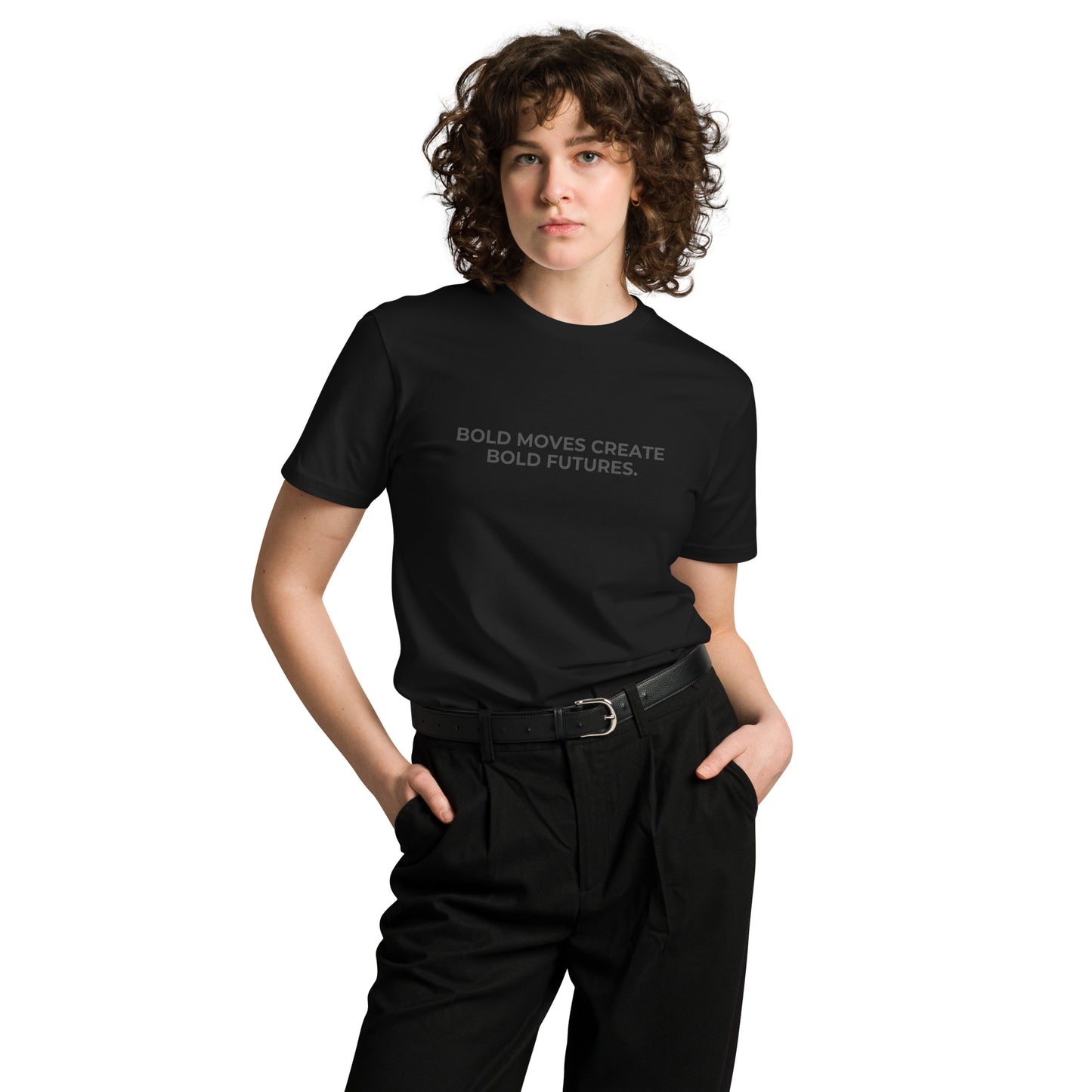 Woman wearing a black premium tee with "Bold Moves Create Bold Futures" text.