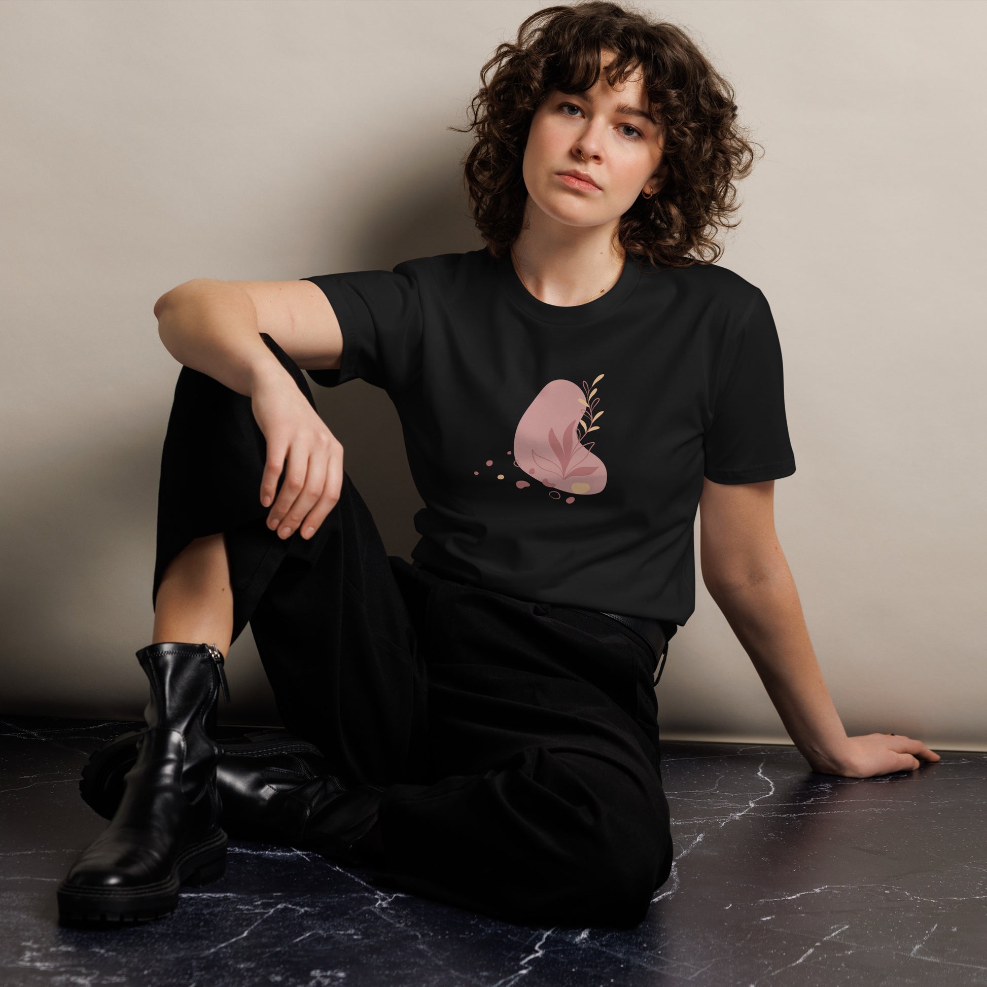  Women's Premium Black Tee featuring a botanical heart design, showcasing a muted and delicate illustration of a heart with botanical elements on a grey tee, perfect for subtle self-expression.