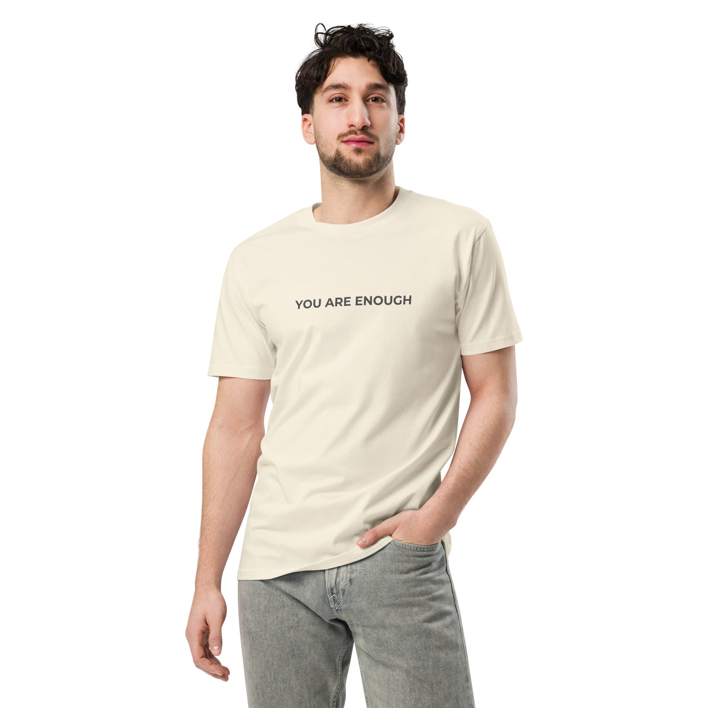 Man wearing a natural premium tee with the text "You Are Enough".