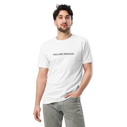 Man wearing a white premium tee with the text "You Are Enough".