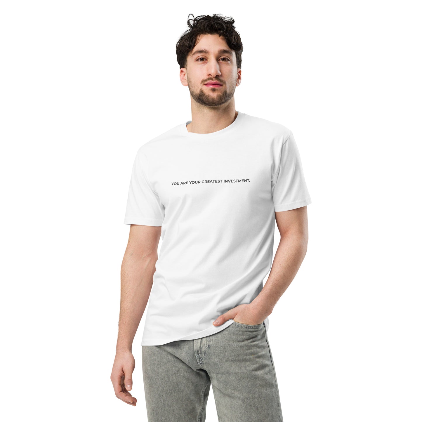 Man wearing a white premium tee with the text "You Are Your Greatest Investment".