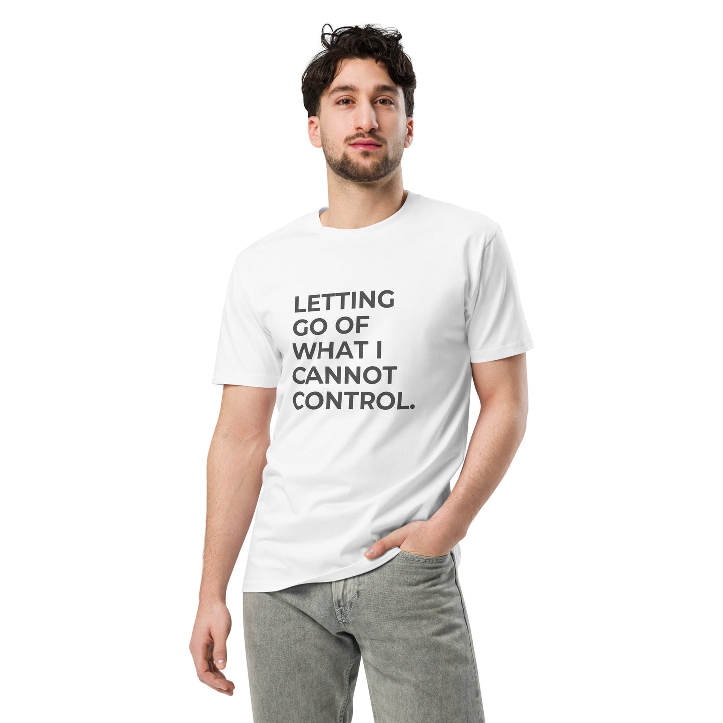 Man wearing a white premium tee with the text "Letting Go of What I Cannot Control" in various colors and sizes from S to 2XL.