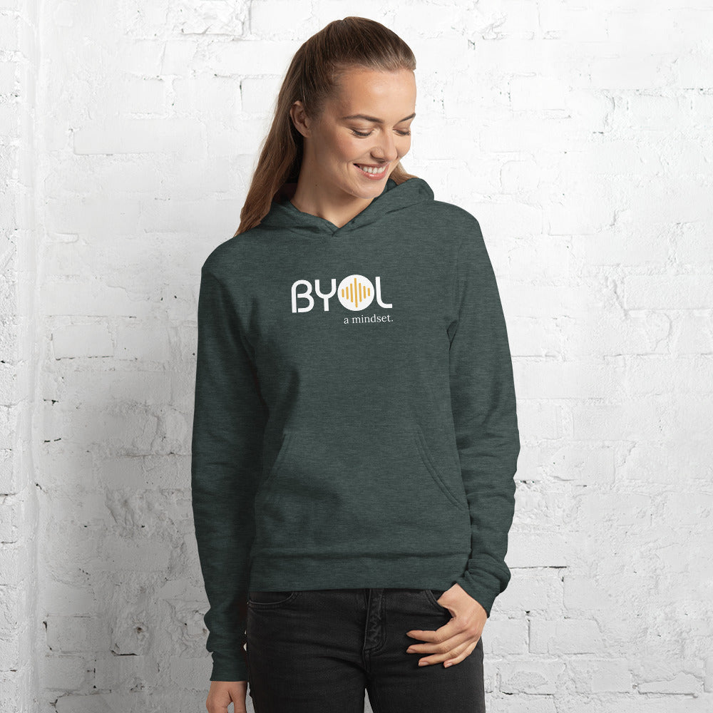 Woman wearing a green BYOL mindset hoodie with color options in black, navy blue, and gray, available in sizes S to 2XL.