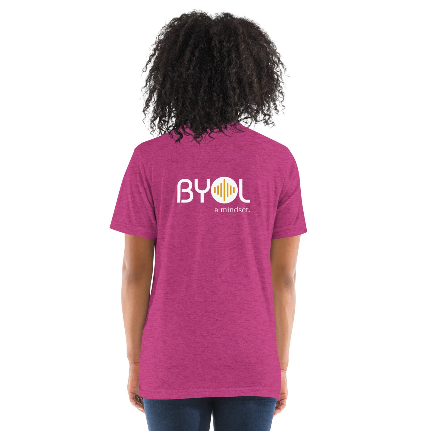 Back view of a woman wearing a berry triblend BYOL mindset t-shirt with color options in black, red, pink, gray, and yellow, available in sizes S to 3XL.