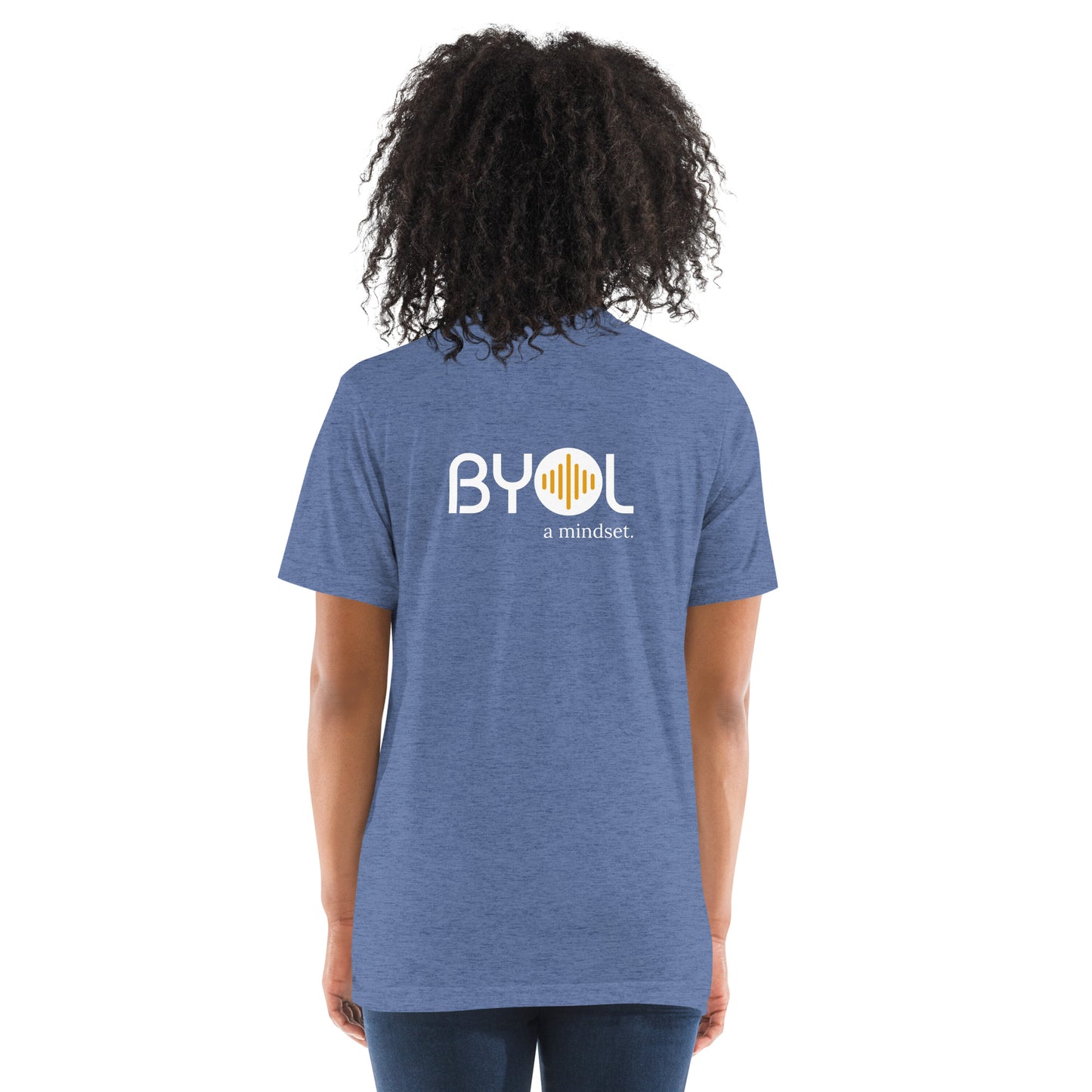 Back view of a woman wearing a blue triblend BYOL mindset t-shirt with color options in black, red, pink, gray, and yellow, available in sizes S to 3XL.