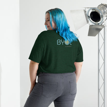 Back view of a woman wearing a emerald tri-blend BYOL mindset t-shirt with color options in black, red, pink, gray, and yellow, available in sizes S to 3XL.