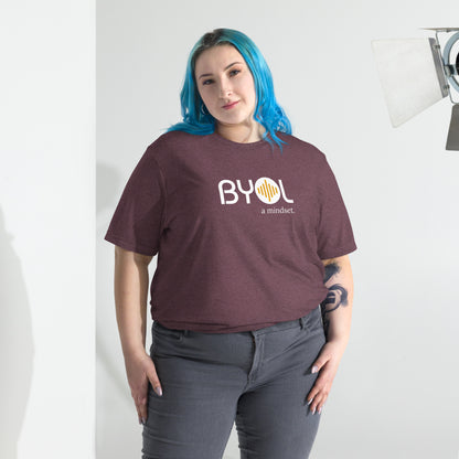 Woman wearing a loose fit BYOL mindset t-shirt in maroon triblend with color options in black, red, pink, gray, and yellow, available in sizes S to 3XL.