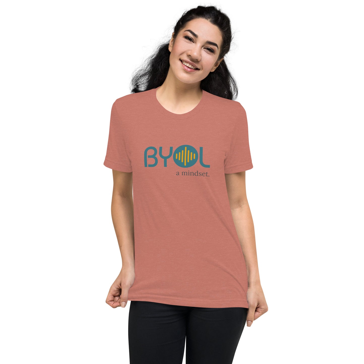 Woman wearing a mauve triblend BYOL mindset t-shirt with color options in black, red, pink, gray, and yellow, available in sizes S to 3XL.