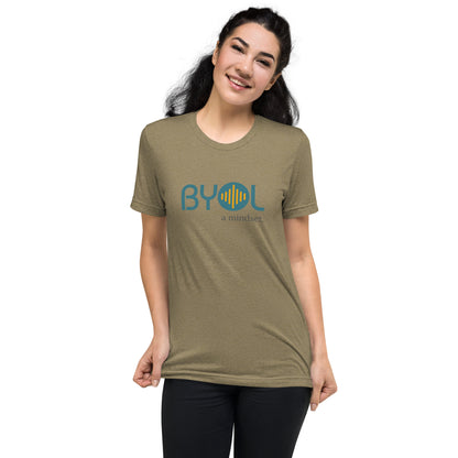 Woman wearing a olive triblend BYOL mindset t-shirt with color options in black, red, pink, gray, and yellow, available in sizes S to 3XL.