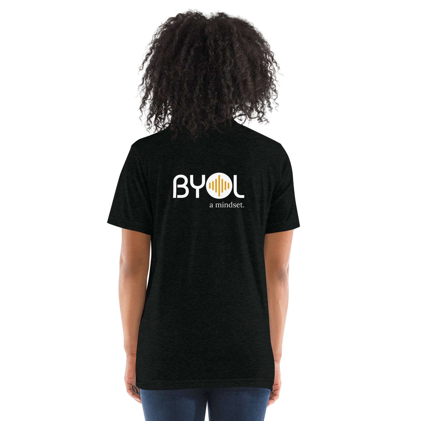 Back view of a woman wearing a grey triblend BYOL mindset t-shirt with color options in black, red, pink, gray, and yellow, available in sizes S to 3XL.