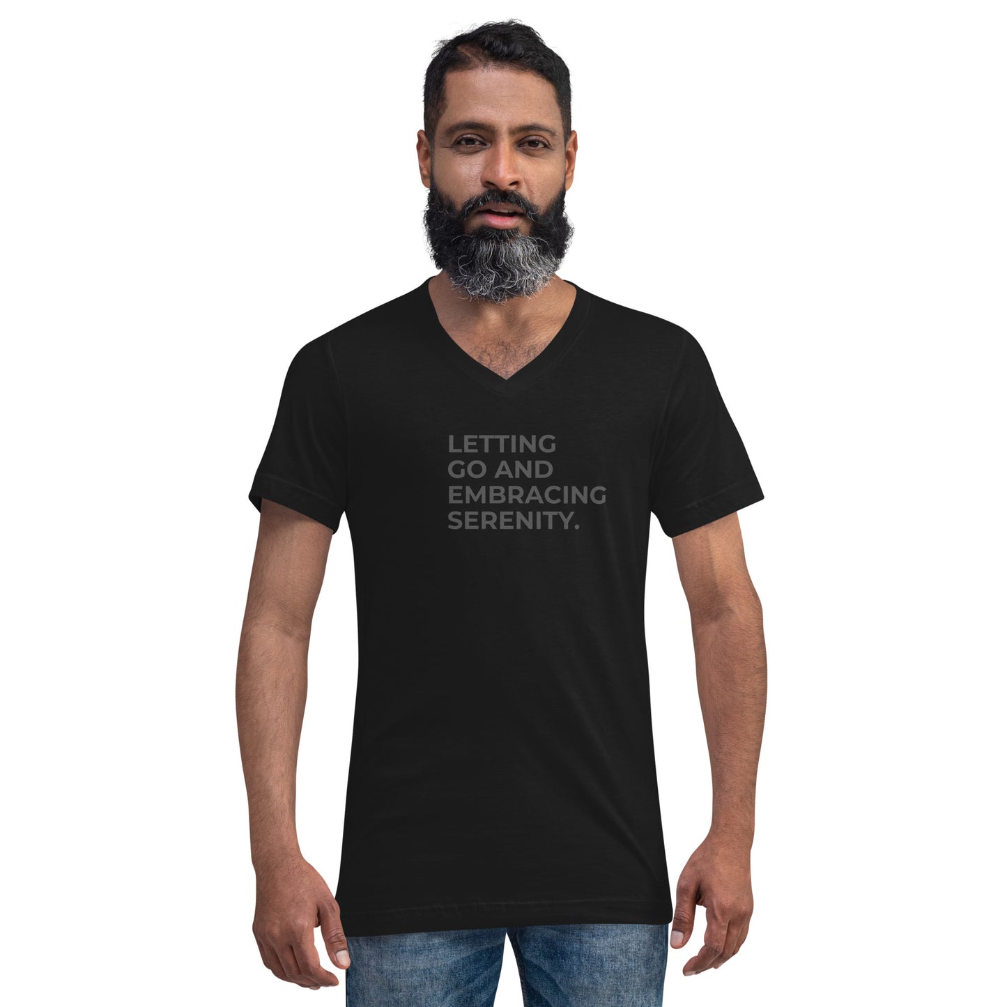 Man with a beard wearing a black v-neck tee with the text "Letting Go and Embracing Serenity".