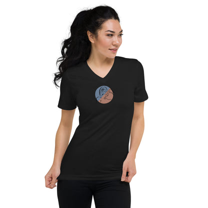 Woman wearing a black V-neck tee with a minimalist silhouette design, embodying subtle style and authenticity.