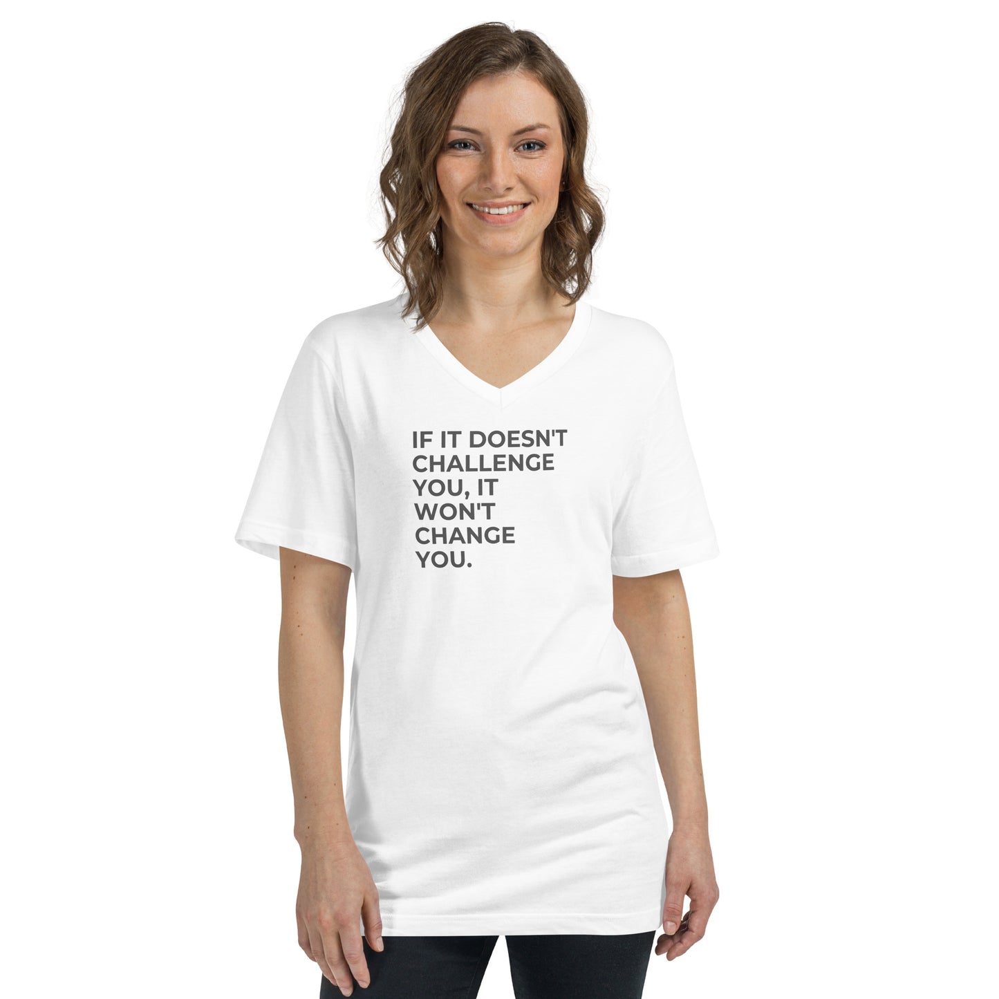 Smiling woman in a white V-neck tee with "If It Doesn’t Challenge You, It Won’t Change You" text.