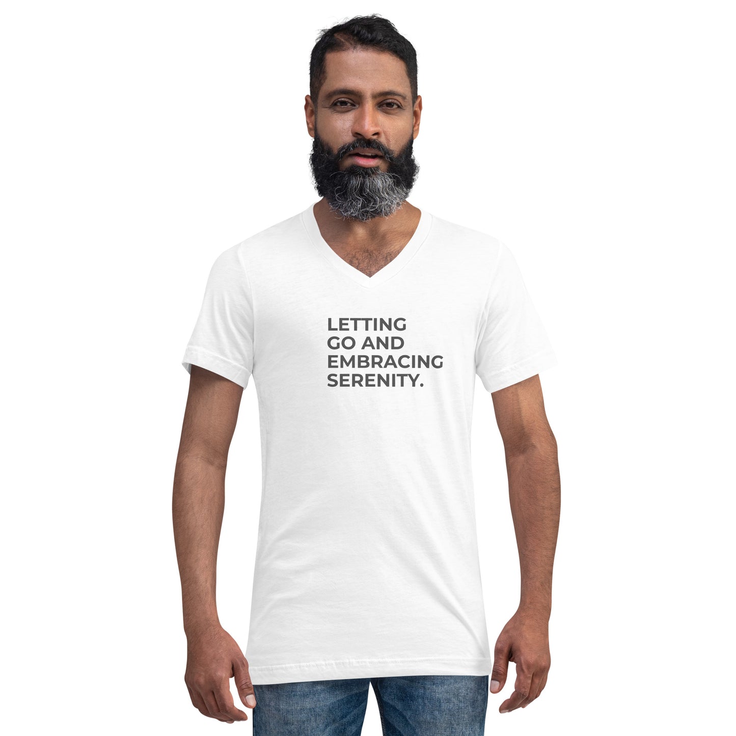 Man with a beard wearing a white v-neck tee with the text "Letting Go and Embracing Serenity".