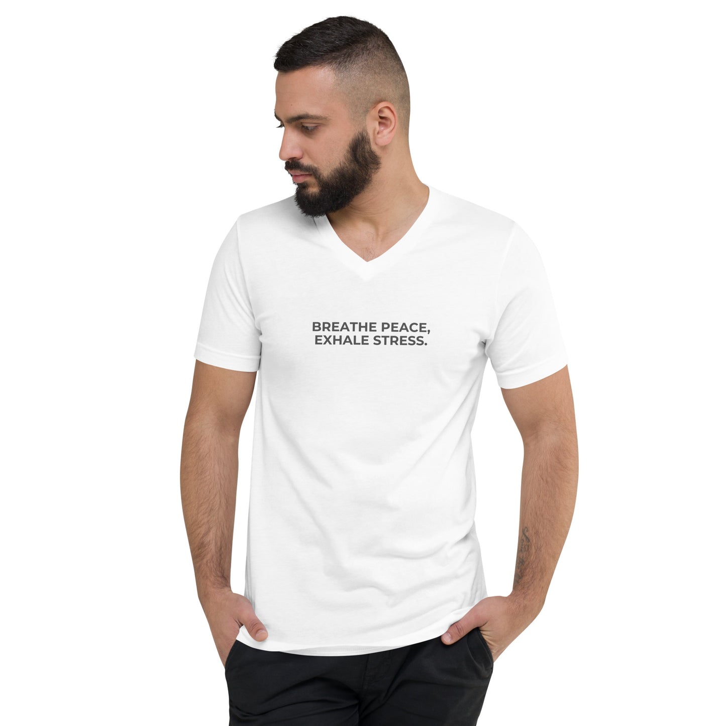 Man with a beard wearing a white v-neck tee with the text "Breathe Peace, Exhale Stress".