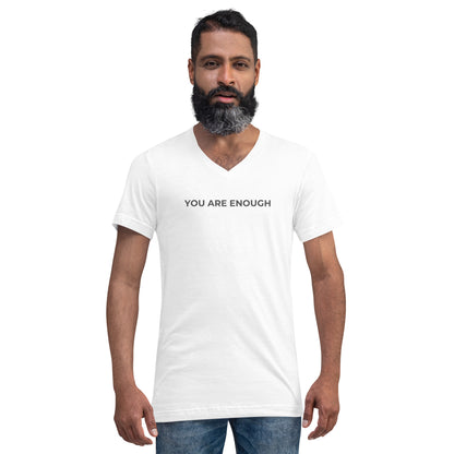 Man with a beard wearing a white v-neck tee with the text "You Are Enough".