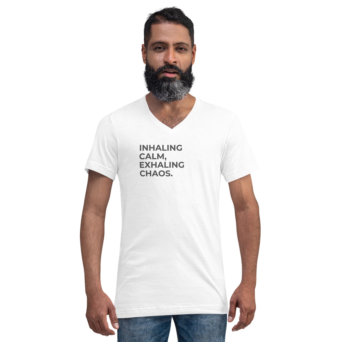 Man with a beard wearing a white v-neck tee with the text "Inhaling Calm, Exhaling Chaos".