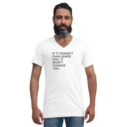 Man with a beard wearing a white v-neck tee with the text "If It Doesn't Challenge You, It Won't Change You".