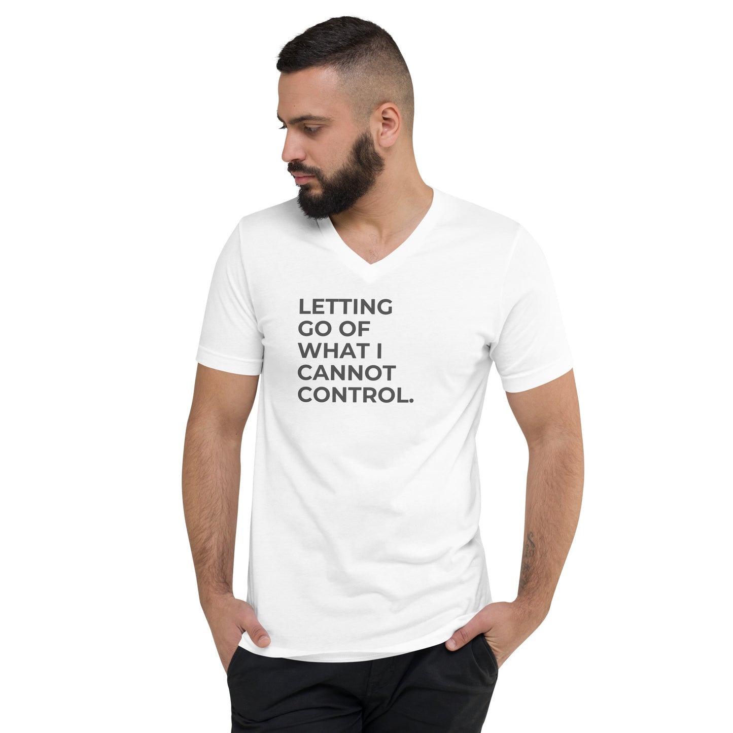 Man with a beard wearing a white v-neck tee with the text "Letting Go of What I Cannot Control".