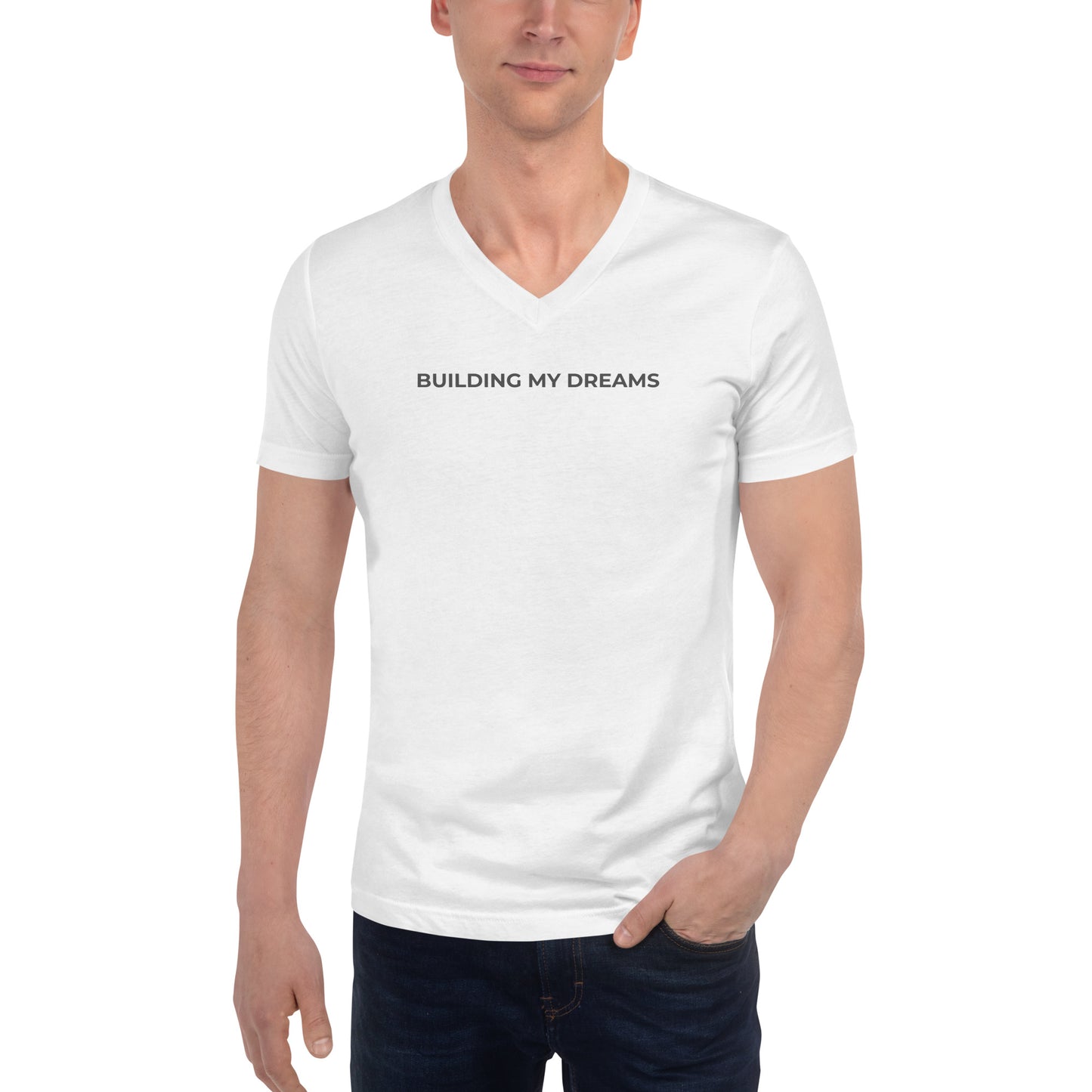 Man wearing a white v-neck tee with the text "Building My Dreams" 