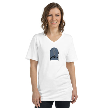 Woman wearing a white V-neck tee with a nightscape design, embodying serenity and subtle expression.