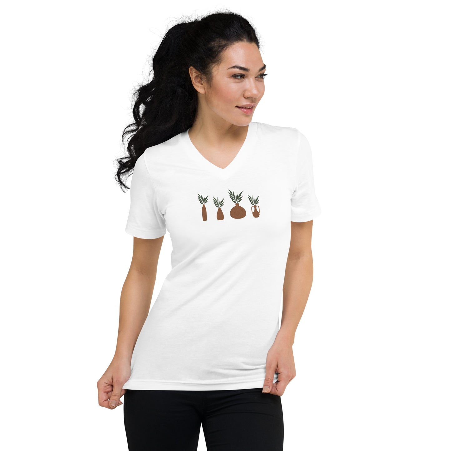 Woman wearing a white V-neck tee with a nature elements design, showcasing authenticity and love for nature.