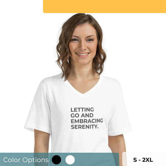 Smiling woman in a white V-neck tee with "Letting Go and Embracing Serenity" text, available in black and white, sizes S-2XL.