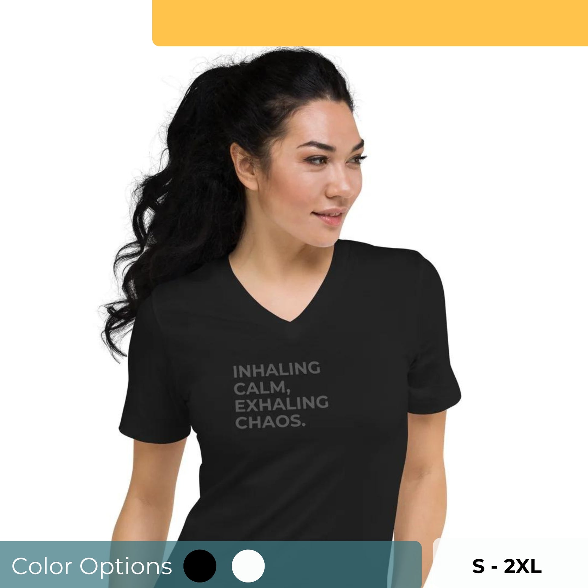 Woman in a black V-neck tee with "Inhaling Calm, Exhaling Chaos" text, available in black and white, sizes S-2XL.