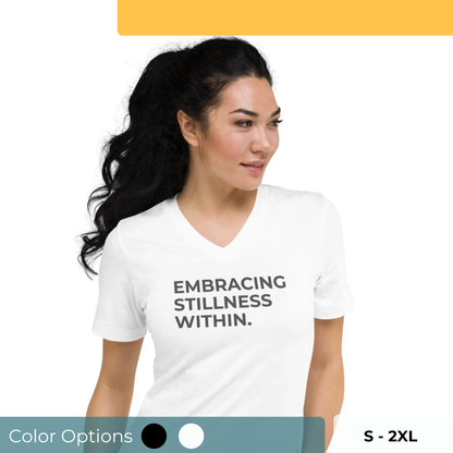 Woman in a white V-neck tee with "Embracing Stillness Within" text, available in black and white, sizes S-2XL.