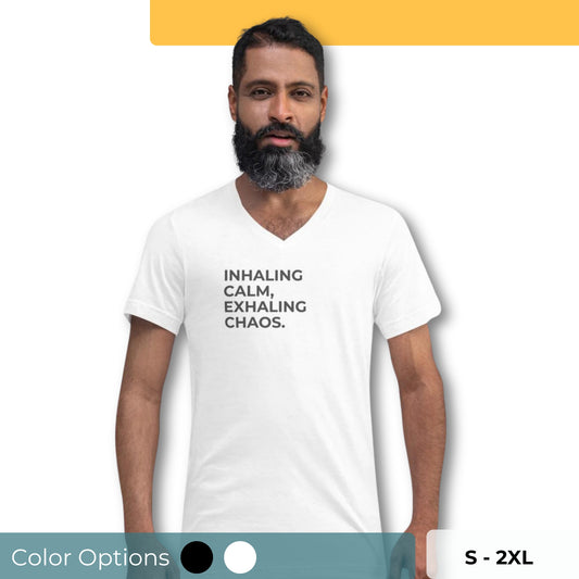 Man with a beard wearing a white v-neck tee with the text "Inhaling Calm, Exhaling Chaos" available in black and white, sizes S to 2XL.