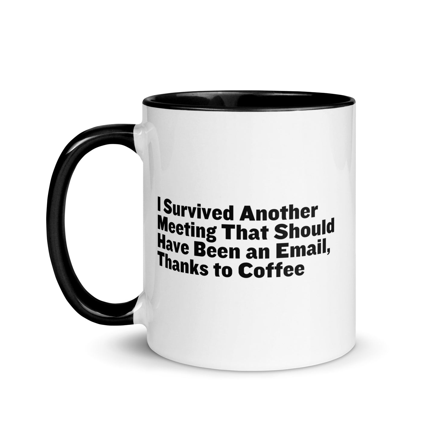 White ceramic mug with black inside and on the handle with words that say, "I survived another meeting that should have been an email, thanks to coffee"