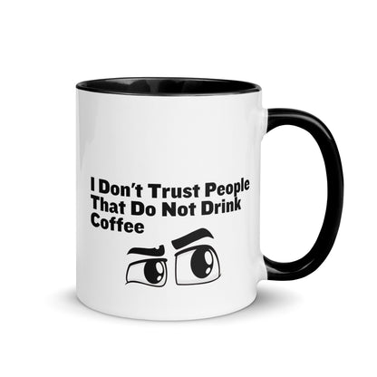 White ceramic mud with black on the inside and on the handle with the words, "I don't trust people that do not drink coffee"