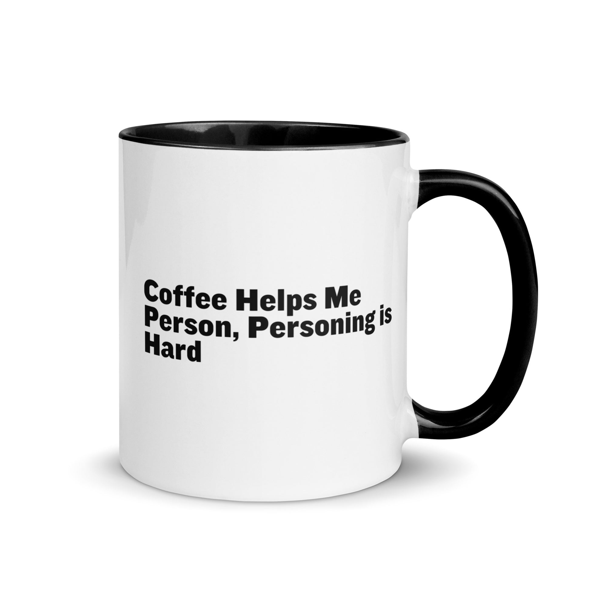 White ceramic mug with black inside and on the handle with the words, "Coffee helps me person, personing is hard"