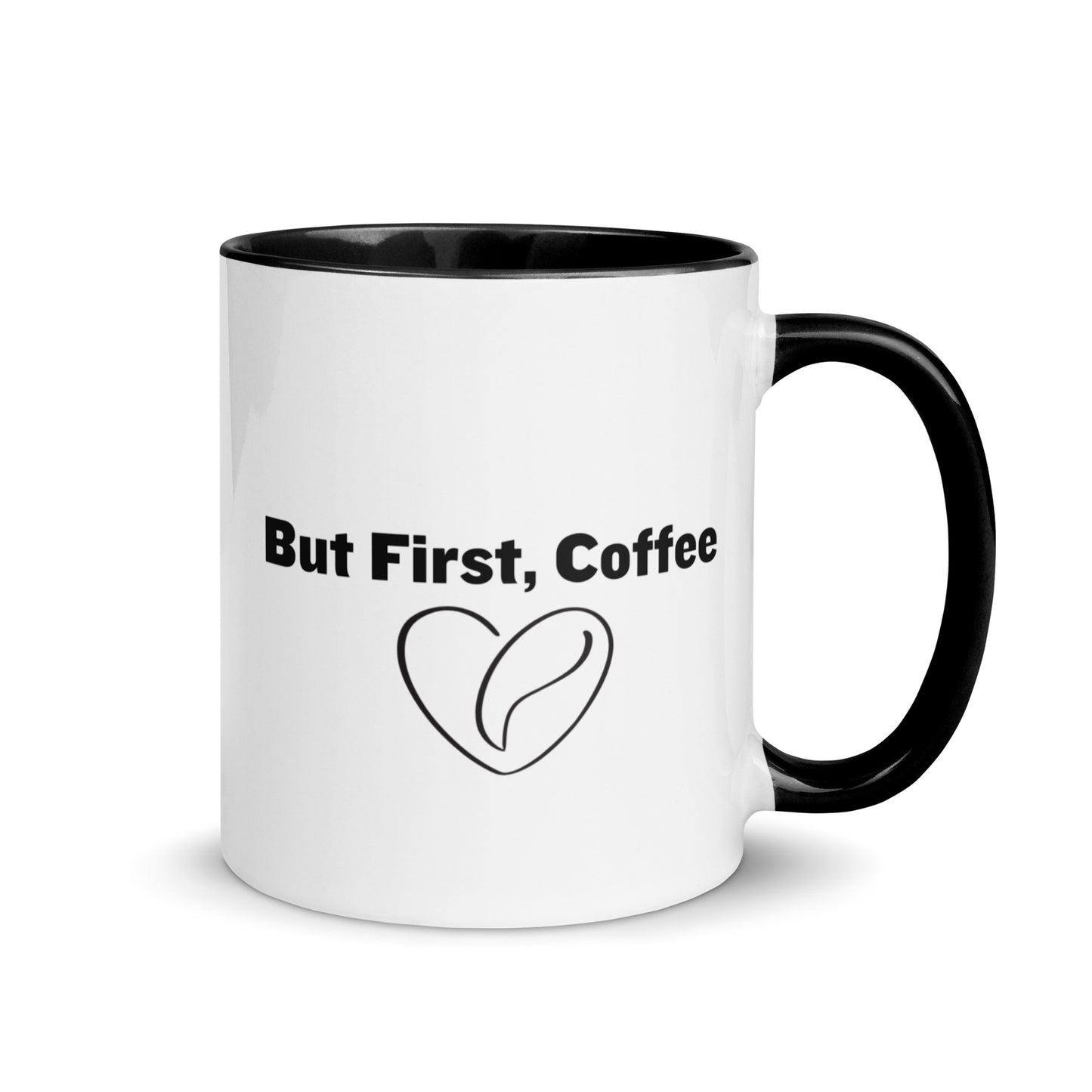 White ceramic mug with black on the inside and on the handle with words that say, "But first, coffee"