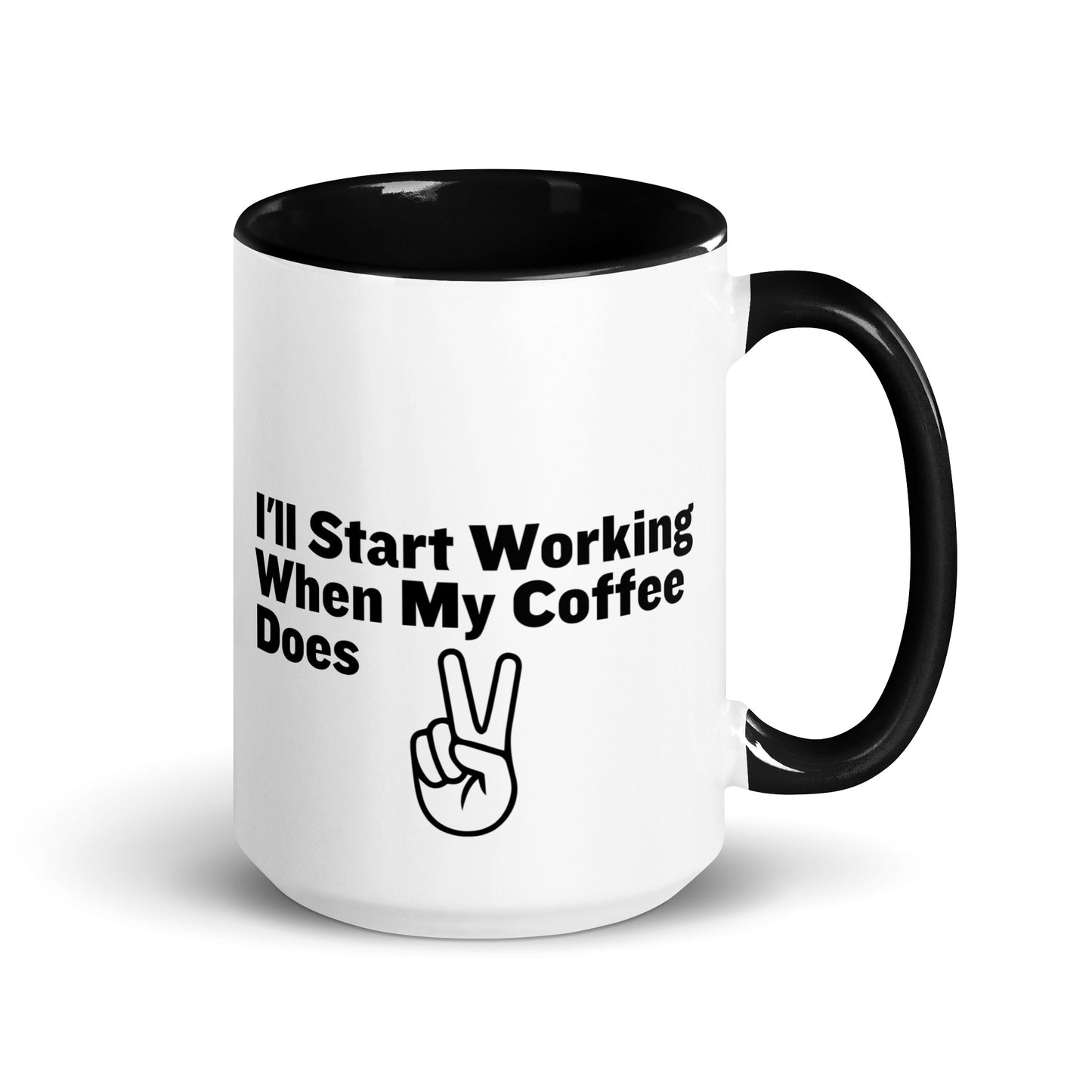 White ceramic mug with a black inside and handle with the words, "I'll start working when my coffee does"