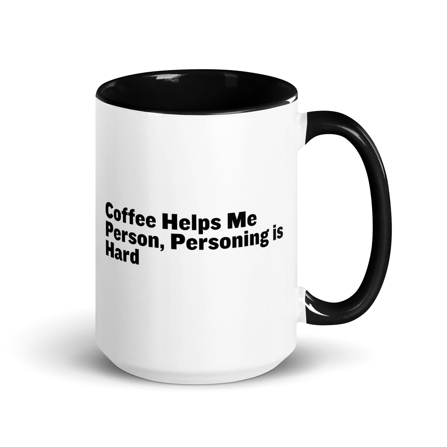 White ceramic mug with black inside and on the handle with the words, "Coffee helps me person, personing is hard"