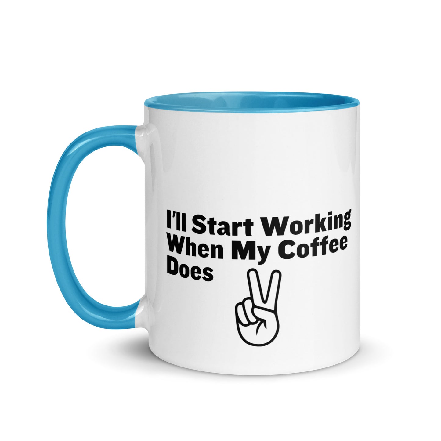 White ceramic mug with a light blue inside and handle with the words, "I'll start working when my coffee does"