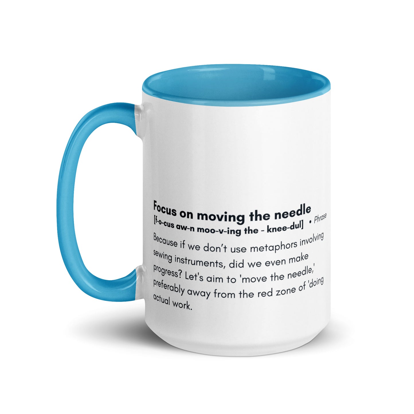 Ceramic white cup with light blue inside and handle with the words, "focus on moving the needle" followed by a humorous definition 