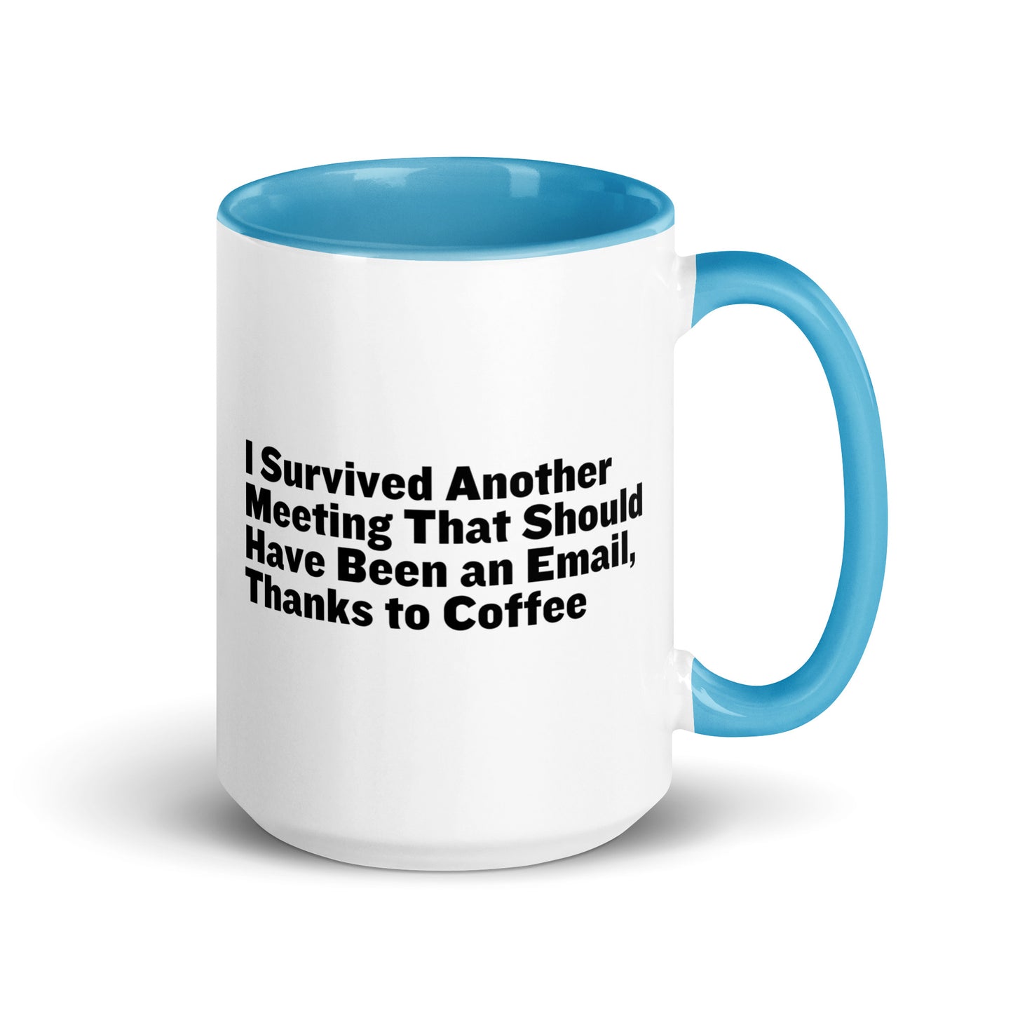 White ceramic mug with light blue inside and on the handle with words that say, "I survived another meeting that should have been an email, thanks to coffee"