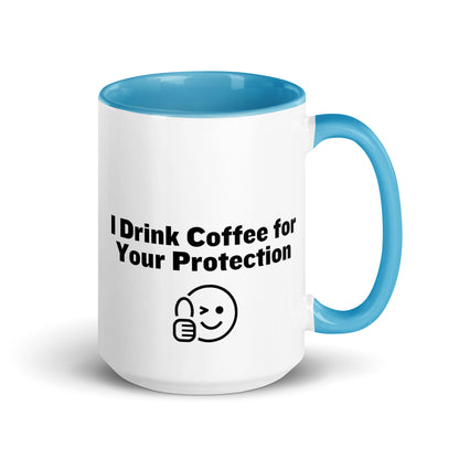 White ceramic mug that is blue inside and on the handle with the words, "I drink coffee for your protection"