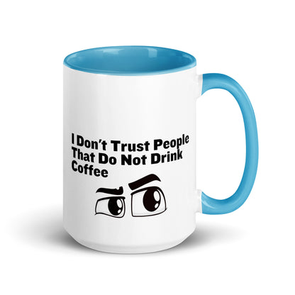 White ceramic mud with light blue on the inside and on the handle with the words, "I don't trust people that do not drink coffee"