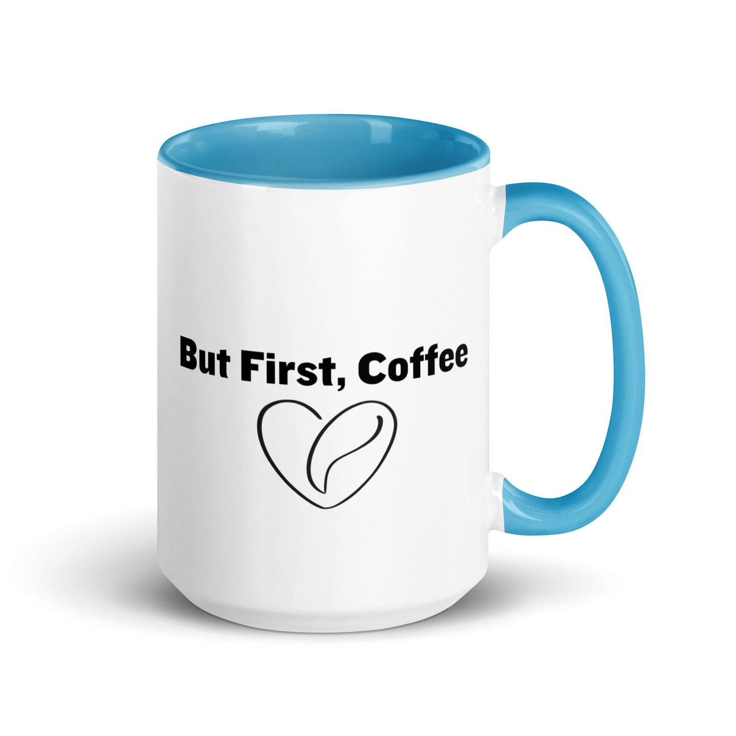 White ceramic mug with blue on the inside and on the handle with words that say, "But first, coffee"