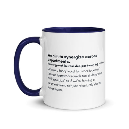 White ceramic mug with blue inside and handle with word,"We aim to synergize across departments" followed by a humorous definition.