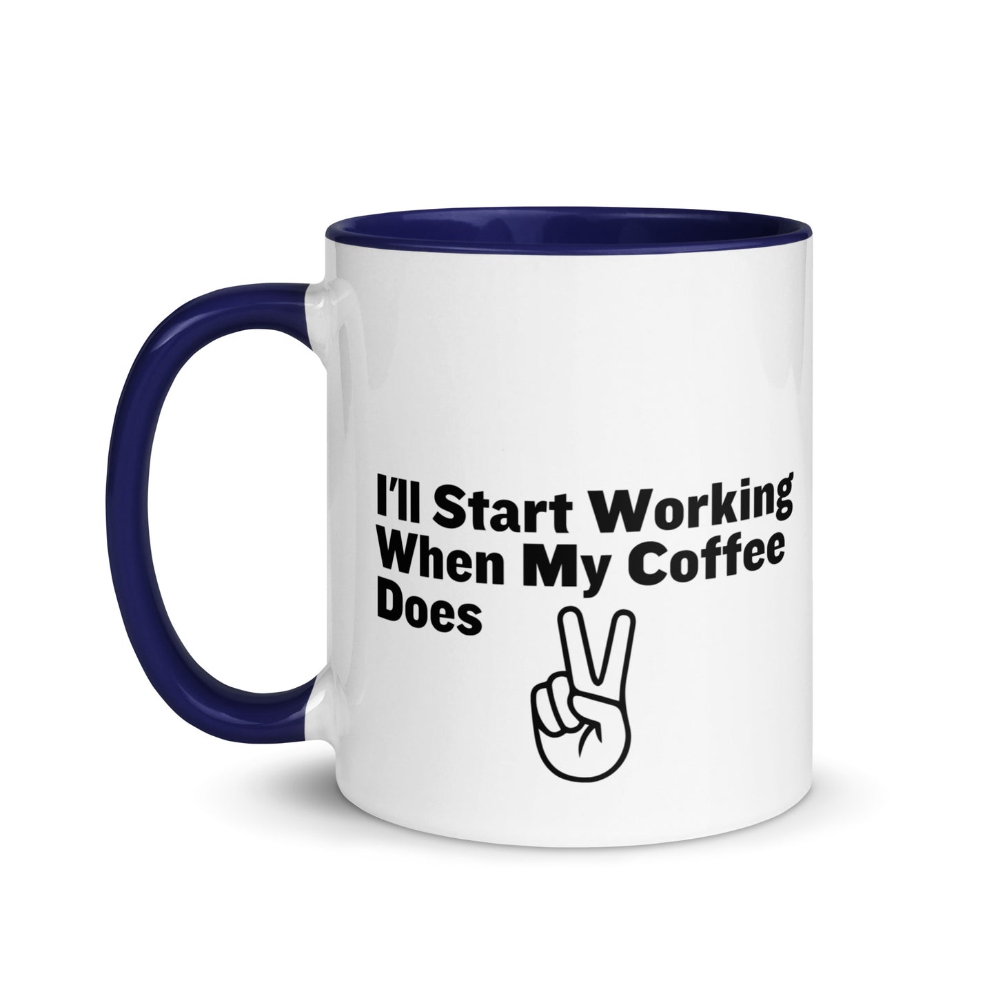 White ceramic mug with a blue inside and handle with the words, "I'll start working when my coffee does"