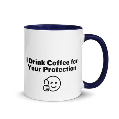 White ceramic mug that is blue inside and on the handle with the words, "I drink coffee for your protection"